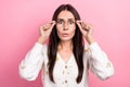 Photo of young impressed young girl business owner brunette watching popular trends updates touch glasses isolated on Royalty Free Stock Photo