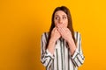 Photo of young lady close lips arms look empty space scared fail trouble over yellow color background