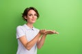 Photo of young lady purple uniform polo holding two hands demonstrating membership swimming pool offer isolated on green Royalty Free Stock Photo