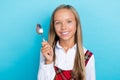 Photo of young little cute schoolgirl woman toothy beaming positive hold spoon delivery restaurant isolated on blue Royalty Free Stock Photo