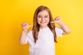 Photo of young little girl happy positive smile point thumbs herself proud winner over yellow color background