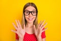 Photo of young lovely excited girl eyewear reaction information isolated over yellow color background