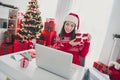 Photo of young lovely girl demonstrate gift box conversation vide call laptop xmas decor holiday indoors Royalty Free Stock Photo
