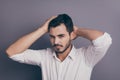 Photo of young macho business man hands touch head hairdo check condition groomed perfect mustache wear white office Royalty Free Stock Photo