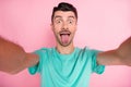 Photo of young man crazy fooling grimacing tongue-out make selfie isolated over pastel color background