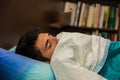 Photo of a young man hiding under a blanket in bed Royalty Free Stock Photo