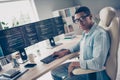 Photo of young man self employed introvert programmer working on freelance github website for coders in internet at