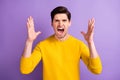 Photo of young man unhappy sad upset yell scream angry accuse conflict problem isolated over violet color background