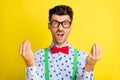 Photo of young man unhappy upset angry mad yell scream quarrel stressed isolated over yellow color background