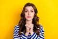 Photo of young nervous stressed depressed woman wear striped blue pullover hands together ask for help isolated on