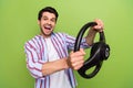 Photo of young overjoyed funny amazed guy enjoy his car holding steering wheel driver impressed reaction isolated on Royalty Free Stock Photo