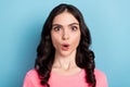 Photo of young pretty lady impressed fake gossip stupor reaction isolated over blue color background Royalty Free Stock Photo