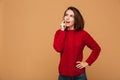 Photo of young pretty thinking woman in red knitted sweater look Royalty Free Stock Photo