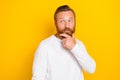 Photo of young redhair beard mustache man good hairstyle touch chin funny grimace hmm tricky plan isolated on yellow Royalty Free Stock Photo