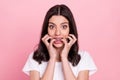 Photo of young scared nervous woman bite nails fingers teeth braces on pastel pink color background