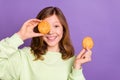 Photo of young school girl happy positive smile close eye cookies funky yummy food isolated over violet color background