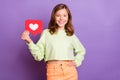 Photo of young school girl happy positive smile show reaction icon heart click advertisement isolated over violet color