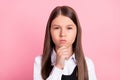 Photo of young school girl serious hand touch chin thoughtful clever isolated over pink color background