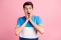 Photo of young shocked frightened crazy guy touch cheeks have problem bad news isolated on pink color background