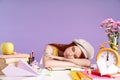 Photo of young student girl sleeping at desk while studying with exercise books Royalty Free Stock Photo