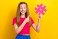 Photo of young teenager schoolgirl wear stylish pink crop top finger directing paper hashtag symbol popular pin isolated