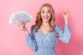 Photo of young triumphant woman curly hair wear flowers dress fist up hooray spend all salary shopping isolated on pink