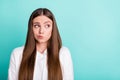 Photo of young unhappy doubtful teenager look empty space bad mood isolated on pastel teal color background Royalty Free Stock Photo