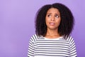 Photo of young unhappy stressed woman have problem look copyspace hesitant isolated on purple color background