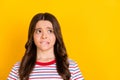 Photo of young unhappy upset stressed worried girl looking copyspace bite lips on yellow color background