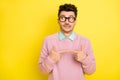 Photo of young unhappy upset worried scared guilty man in glasses look copyspace isolated on yellow color background