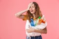 Photo of young unhappy woman holding plastic waste and crying Royalty Free Stock Photo