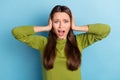 Photo of young woman close arms ears scream loud irritation quarrel enough isolated over blue color background Royalty Free Stock Photo