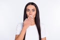 Photo of young woman close cover lips hand oops fail mistake tell secret problem isolated over white color background Royalty Free Stock Photo