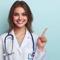 Photo of young woman doctor happy positive smile indicate finger empty space ad advice clinic isolated over teal color background