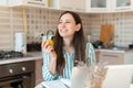 Photo of young woman eating an apple in pause of work from home