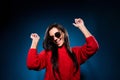 Photo of young woman happy positive smile have fun enjoy music dance party isolated over dark blue color background Royalty Free Stock Photo