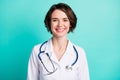 Photo of young woman happy positive smile medic surgeon hospital isolated over turquoise color background