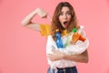 Photo of young woman holding and pointing finger at plastic waste Royalty Free Stock Photo