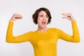 Photo of young woman irritated show hands speak talk dialog blah bla mocking isolated over grey color background Royalty Free Stock Photo