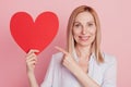 Photo of young woman point finger big heart valentine day choice advert isolated over pink background Royalty Free Stock Photo