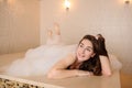 photo of a young woman in white foam relaxing in a hamam Royalty Free Stock Photo