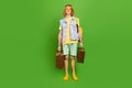 Photo of youngster guy hold suitcase rucksack ready road trip wear denim jeans vest shorts isolated vivid color