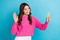 Photo of youngster teen age school lady wear pink knitted pullover hold phone shooting smartphone palm greeting isolated Royalty Free Stock Photo