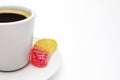 A photo of your white porcelain coffee cup, colorful yellow and red fruit jelly citrus sugar candy. Delicious black turkish coffee Royalty Free Stock Photo