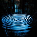 Photobanner, a drop of water breaks the water surface with concentric ripples on a dark blue water surface. Water Royalty Free Stock Photo
