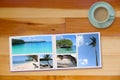 Photobook Album on Wooden Floor Table with Travel Photos and Coffee or Tea in Cup