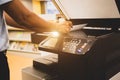 Photocopier printer, Close up hand office man scanning paper on the copier or photocopy machine concept of scanner document or Royalty Free Stock Photo