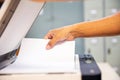 Photocopier printer, Close up hand office man scanning paper on the copier or photocopy machine concept of scanner document or Royalty Free Stock Photo