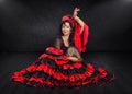 Photogenic Spanish dancer sits on stage Royalty Free Stock Photo