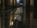 An abandoned and broken umbrella on the ground of the square. Royalty Free Stock Photo